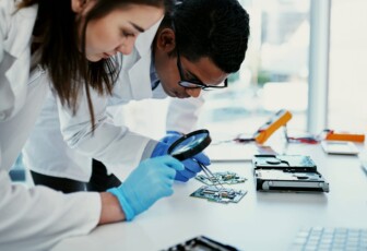 Two scientists with circuit board in lab e1754971130204 2048x1164